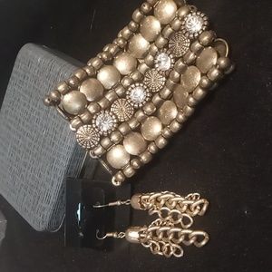 Expandable metal beaded bracelet and chain drop earrings.
